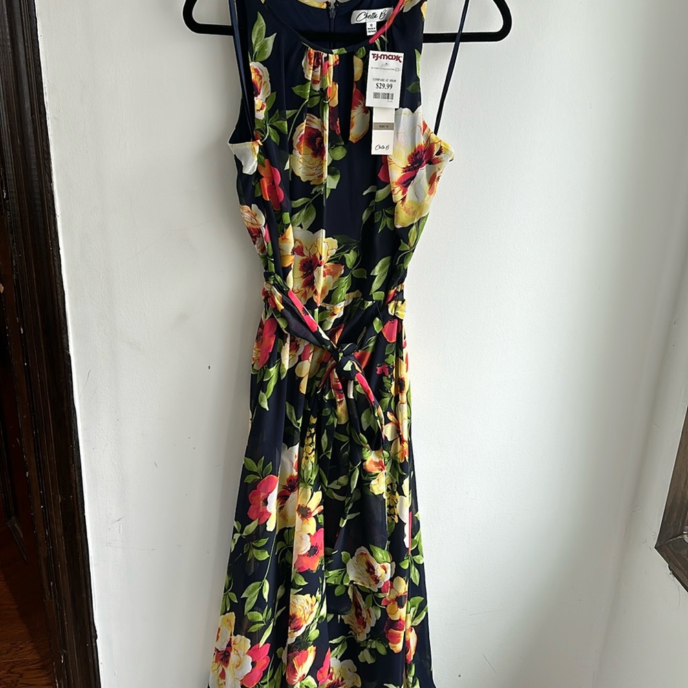 Lovely navy floral chiffon like dress. Never worn! Perfect for spring flings!
